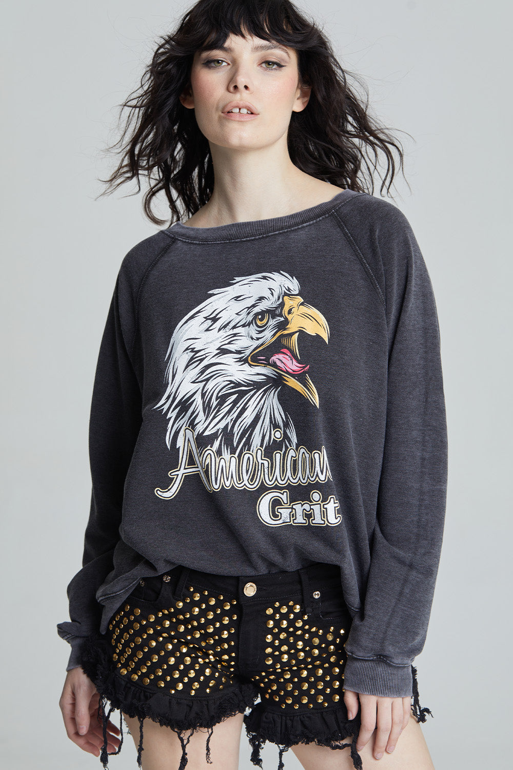 Black oversized 'American Grit' sweatshirt with a bald eagle graphic and 'American Grit' text.