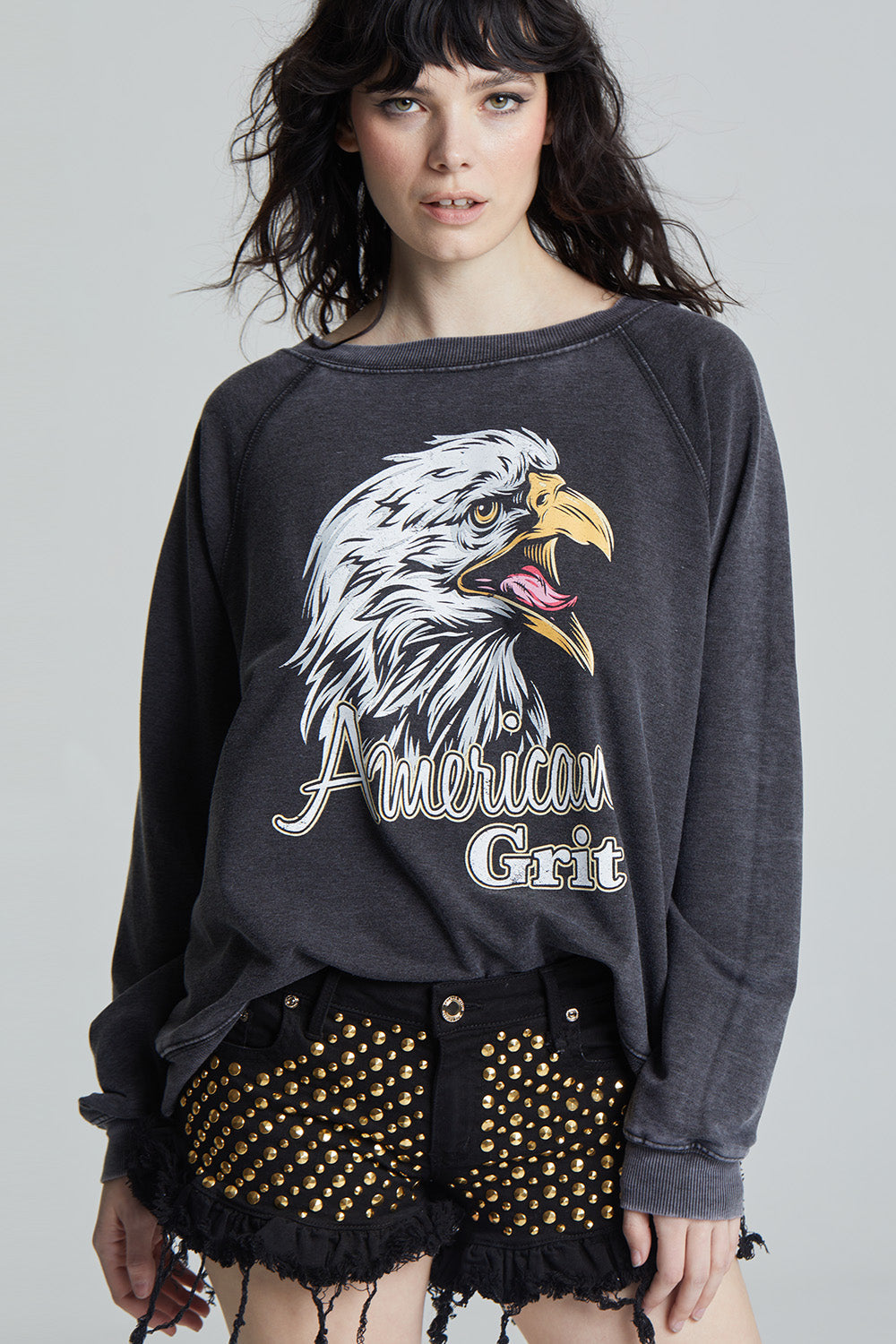 Black oversized 'American Grit' sweatshirt with a bald eagle graphic and 'American Grit' text.
