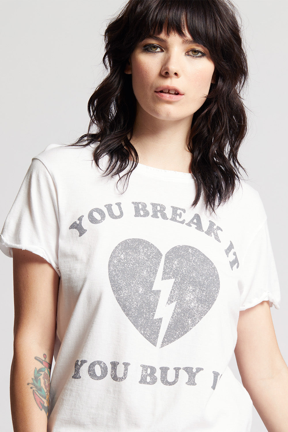 Women's You Break It You Buy It T-shirt in White with broken heart graphic