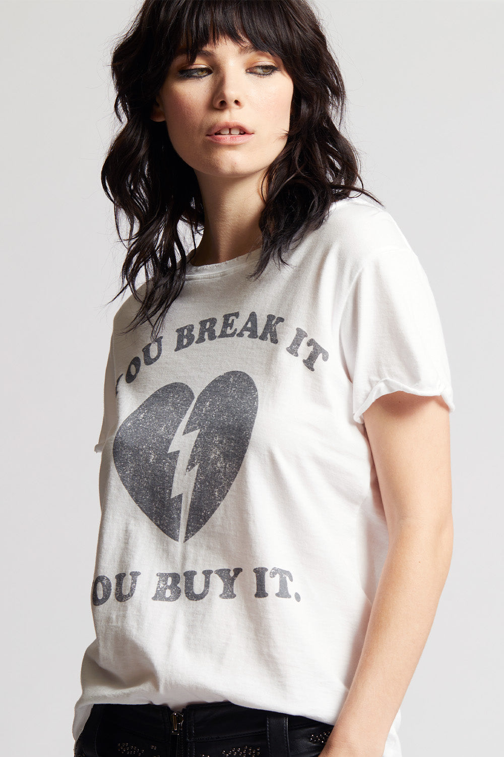 Women's You Break It You Buy It T-shirt in White with broken heart graphic